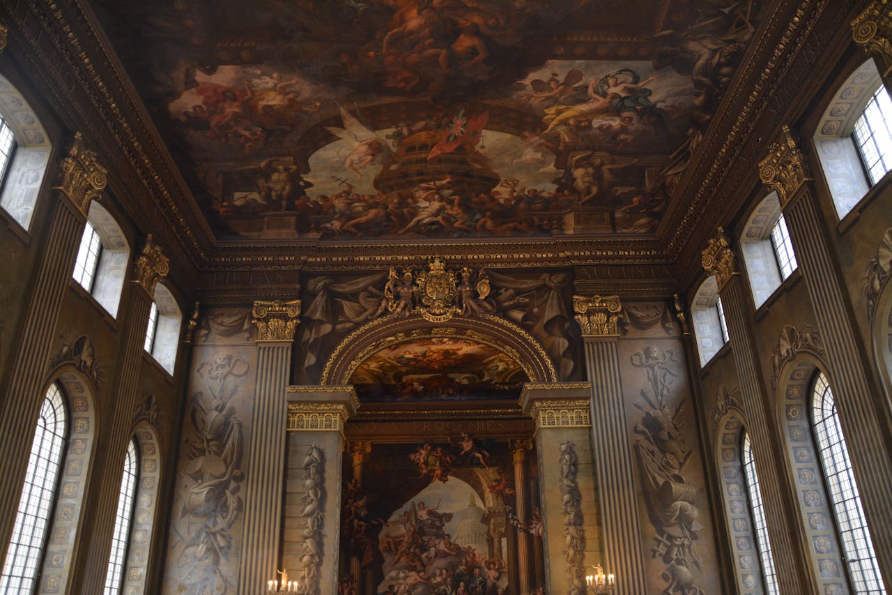 services-04 Luxurious interior with intricate ceiling artwork and grand architecture.